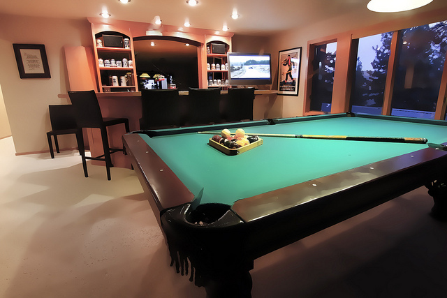 Clean man cave layout with the must have furniture