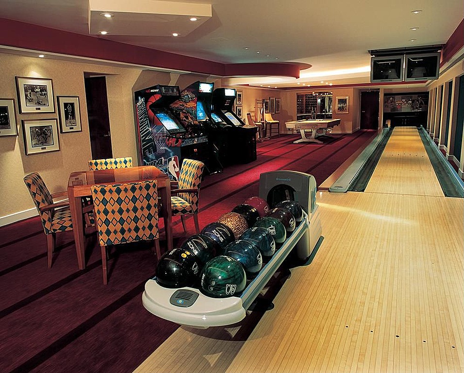 Private bowling alley located in this man cave with arcade games and billiard table